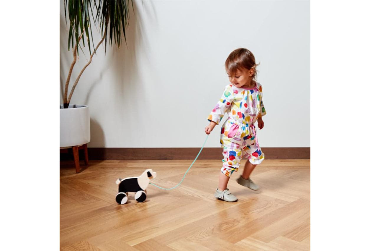 Child pulling The Pull Pup by Lovevery